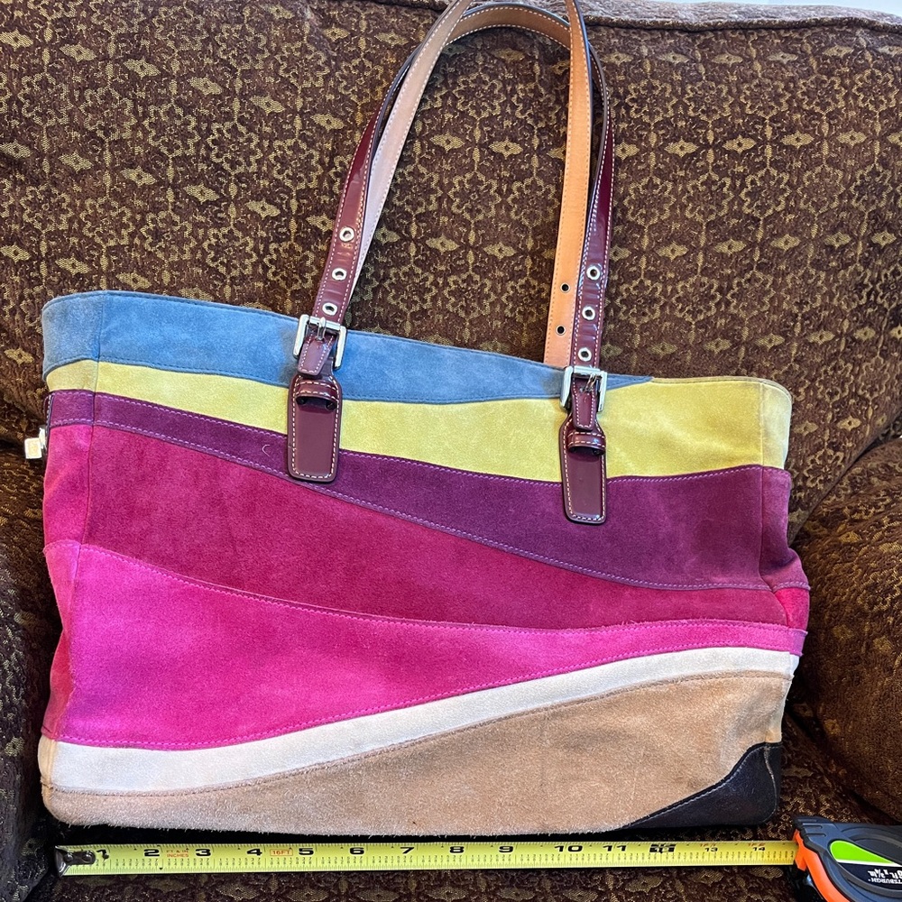 Coach multi colored suede tote bag with leather handles.